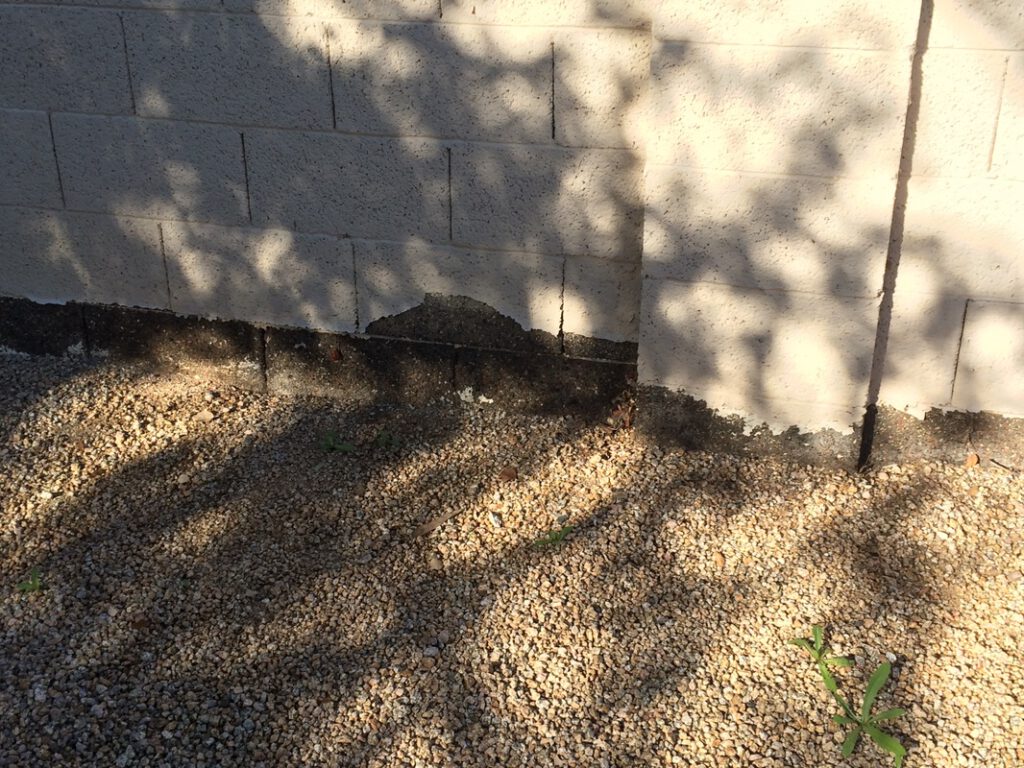 re-stucco, paint and rake rocks back-up along all of Ash