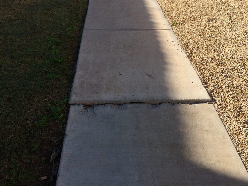 Sidewalk repair by city required
