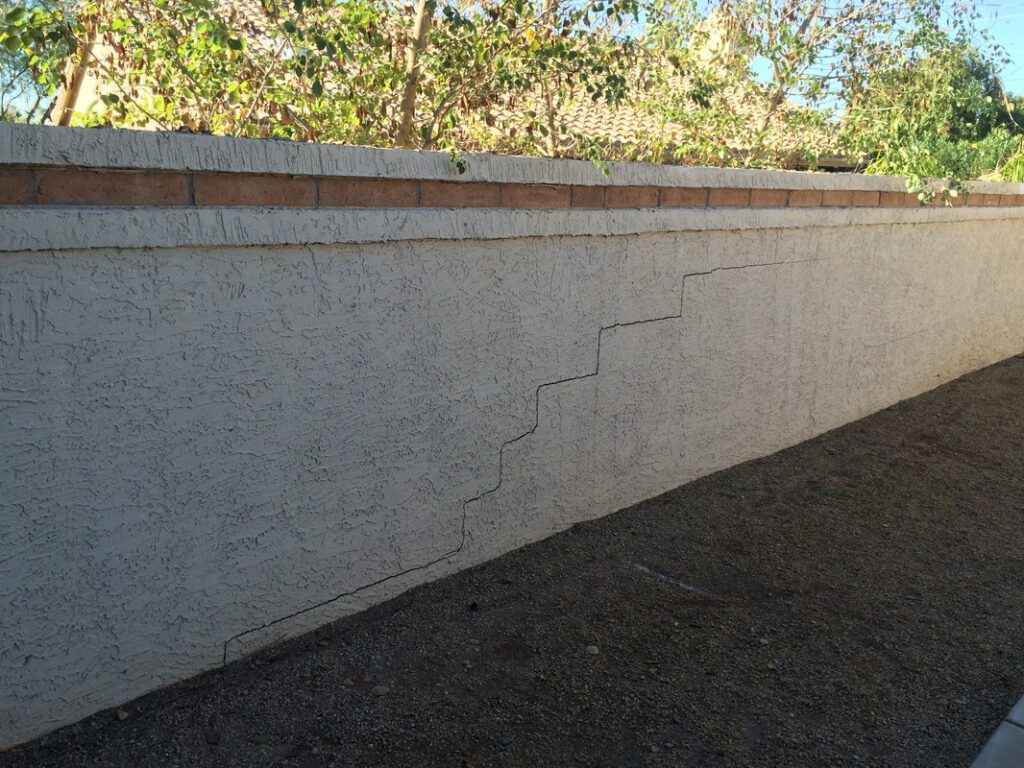 Corking required on common walkway wall behind Lot # 194 - Far East end on Carver